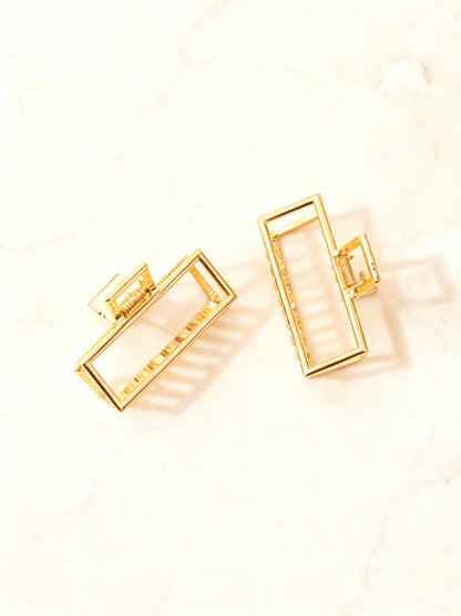 Chérie claw clip open and closed from above on marble