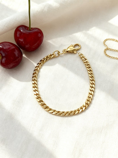 Étoile gold bracelet stainless steel nickel-free flat lay with cherries